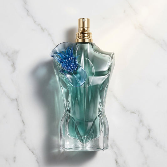 Jean Paul Gaultier Le Beau Flower Edition bottle on marble
